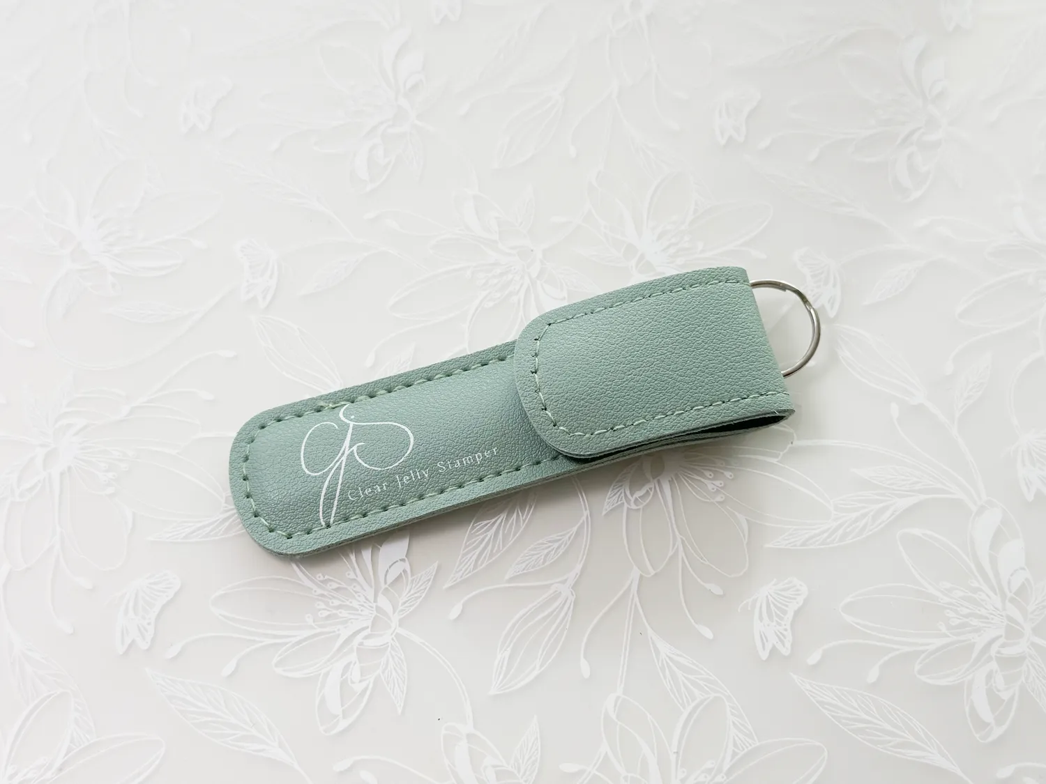 Clear Jelly Stamper Key Chain glasfil teal